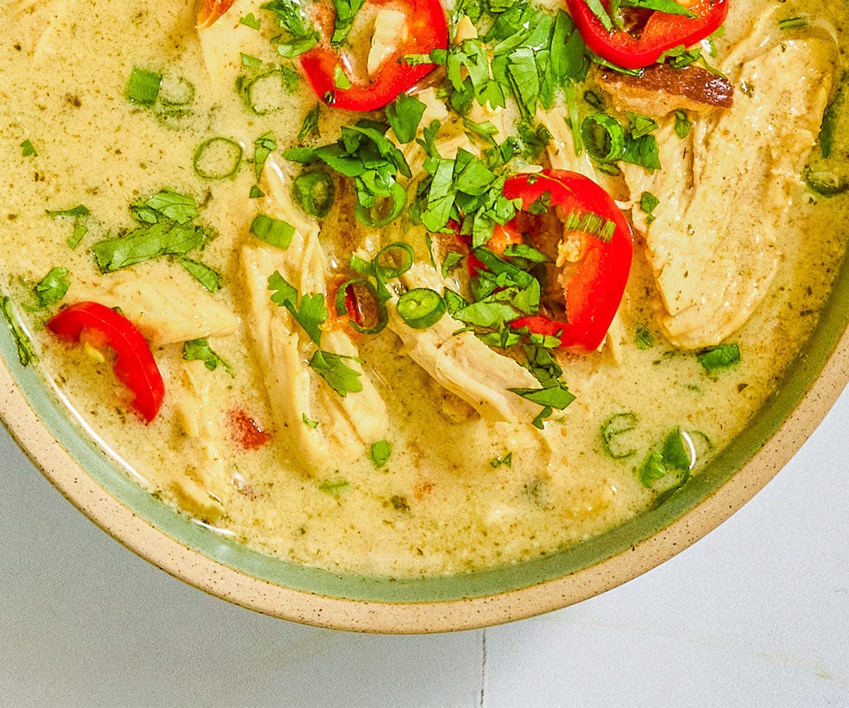 Overhead image of finished Thai coconut curry soup in a bowl. 